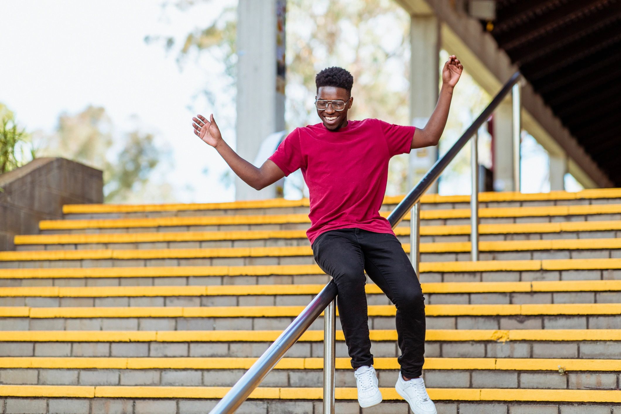 Young man expressing joy in an urban environment